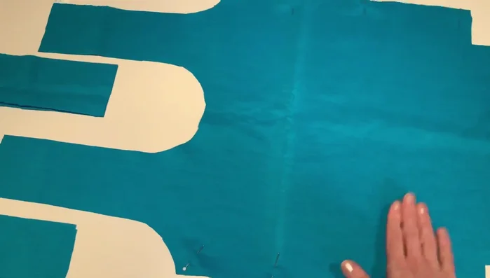 Pin the corners of the bag, matching seams. Sew across the short edge to give the bag dimension. Repeat for all four corners.