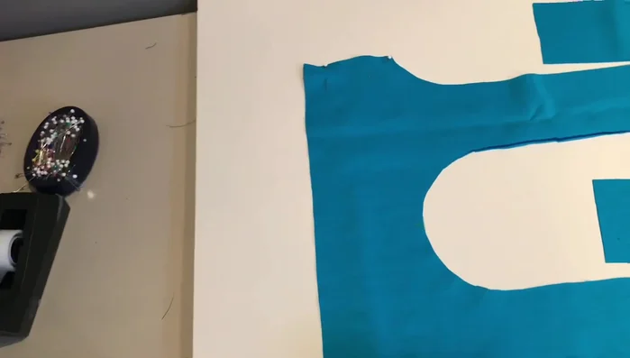 Pin the corners of the bag, matching seams. Sew across the short edge to give the bag dimension. Repeat for all four corners.