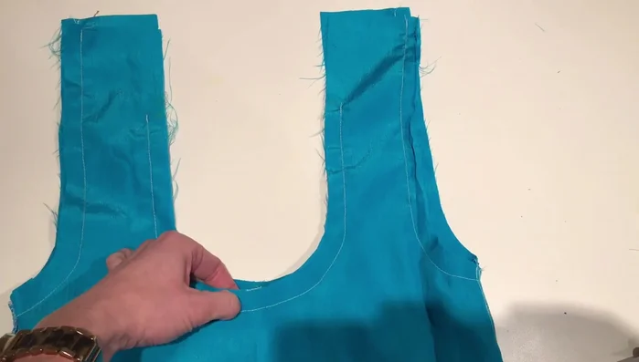 Press edges and sew the straps together, leaving an opening at the top. Turn under the seam allowance and press it flat.