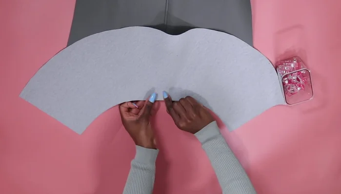 Attach the peplum to the bottom of the skirt, using clips to hold the pieces together. Sew and top stitch the seam.