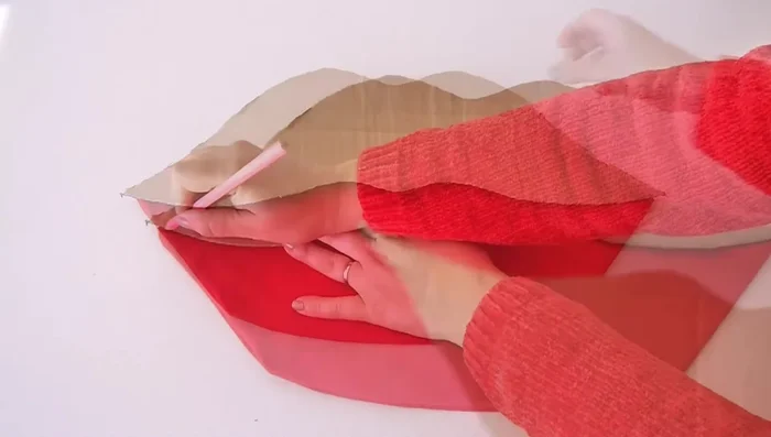 Mark and sew the center line: Use one half of the original template to mark the center line of the pillow. Sew a straight stitch along this line to close up the pillow.