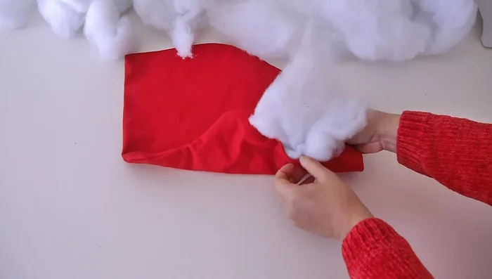 Fill the pillow: Stuff the pillow with polyfill or other stuffing material using a wooden stick to help push it into every corner.