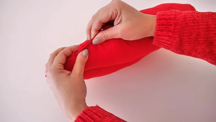 Close the gaps: Close the gaps at the top and bottom using either an invisible stitch or hot glue.