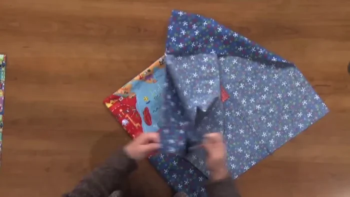Layer the quilt: Lay the backing right side down, then center the batting on top. Place the quilt top on the batting, right side up.