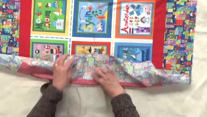 Align and pin the remaining sides: Repeat step 5 for the other two sides, ensuring all creases and edges are aligned.