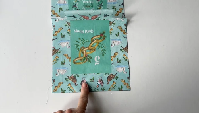 Fold the outer piece in half, matching raw edges, and crease the bottom edge.