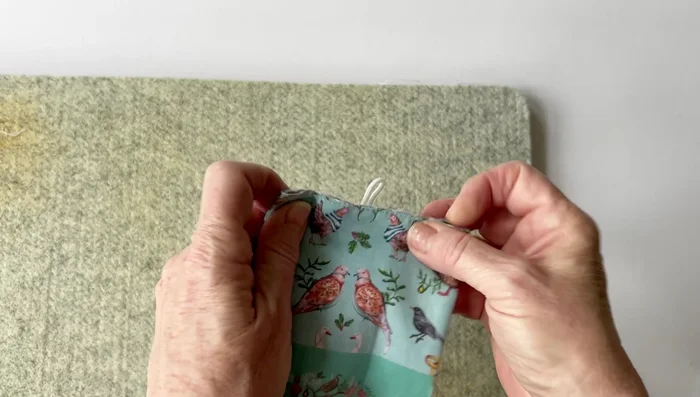 Fold the bag, loop the elastic over the button, and your fold-over bag is finished!