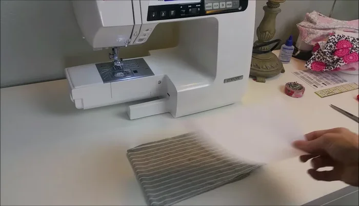 Cut out fabric using a template. Fold fabric in half with stretch going side to side, place template on fold and cut.