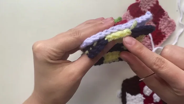 Sew the top and bottom panels together. Match corresponding stitches for an even seam.