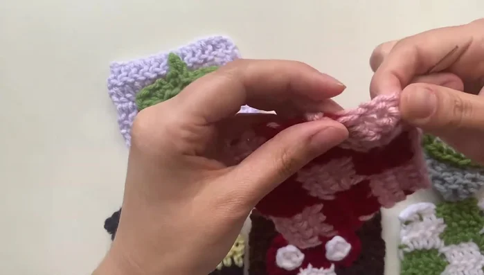 Continue sewing the panels together by alternating between the panels, securing stitches between them and tying off at the end. It's okay to adjust the stitches if they are uneven or spaced strangely.