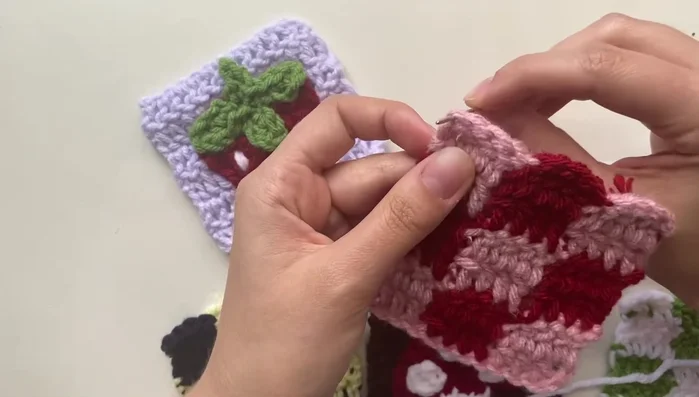 Continue sewing the panels together by alternating between the panels, securing stitches between them and tying off at the end. It's okay to adjust the stitches if they are uneven or spaced strangely.