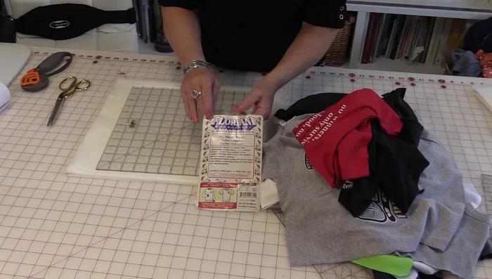 Press and fuse stabilizer to the back of each t-shirt square to prevent stretching.