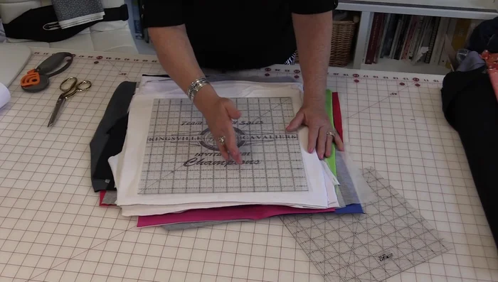 Assemble blocks with 5 t-shirts per row, 6 rows total.