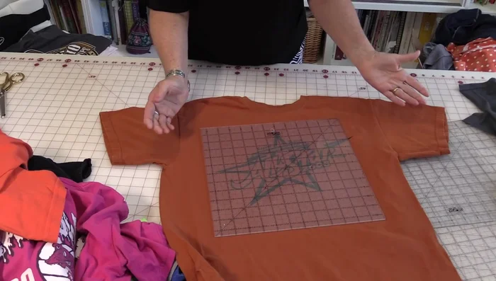 Cut out t-shirt squares, adding extra fabric for easier handling.
