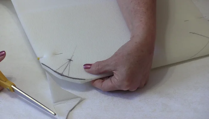 Cut out the bag body and flap pieces, including the darts and rounded corners.