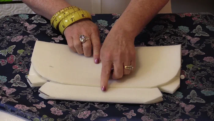 Sew the magnets onto the Soft & Stable using a zigzag stitch with only width, no length, to secure them. Avoid sewing directly over the metal.