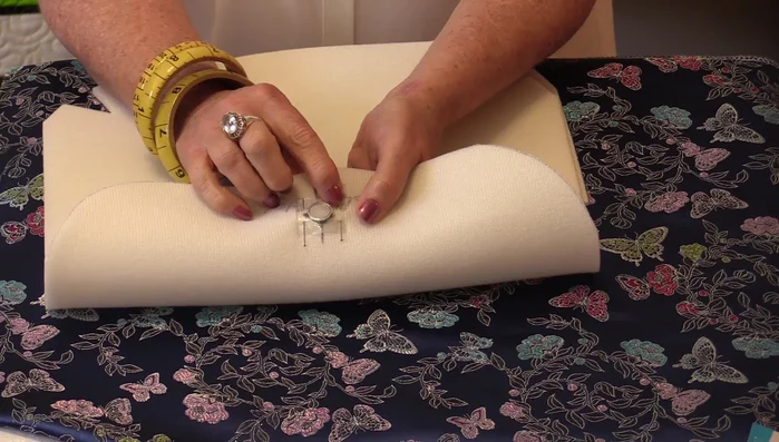 Sew the magnets onto the Soft & Stable using a zigzag stitch with only width, no length, to secure them. Avoid sewing directly over the metal.