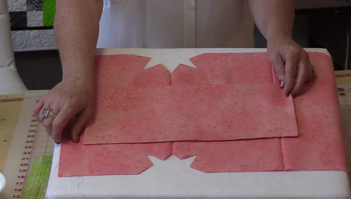 Sew the pocket to the lining, positioning it in the center. Ensure the pocket extends slightly beyond the lining's bottom, allowing it to seal when the flap is closed.