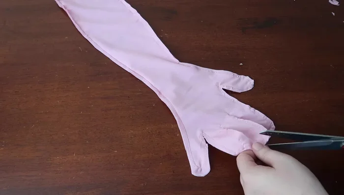 Finish opening: Create a small hem at the wrist opening and sew it down with a zigzag stitch.