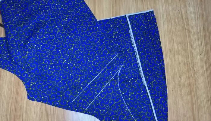 Sew the added fabric pieces to the back piece.