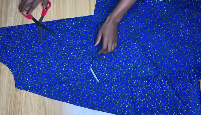 Sew the added fabric pieces to the back piece.