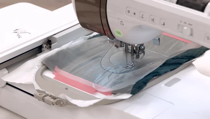 Trim excess fabric and remove the water-soluble topper.