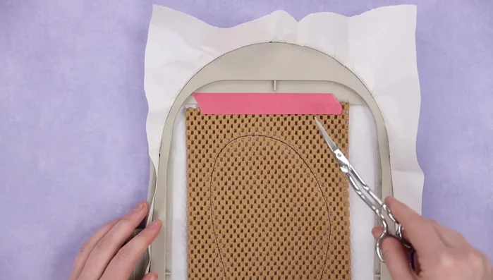 Run the placement stitch for the batting. Place the batting over the design, cover completely, and run the tacking stitch for the batting.