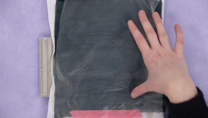 Trim excess fabric and remove the water-soluble topper.