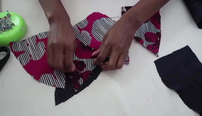 Sew the bralette cups: Place right sides of the main fabric and lining fabric together, pin, and sew from the top to the bottom curve of the cup. Repeat for all four cups.