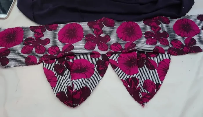 Attach lining, main fabric and straps: Place the lining fabric and main fabric together, right sides facing. Insert the straps between the layers, pin, and sew all around, leaving the sides open for the zipper.