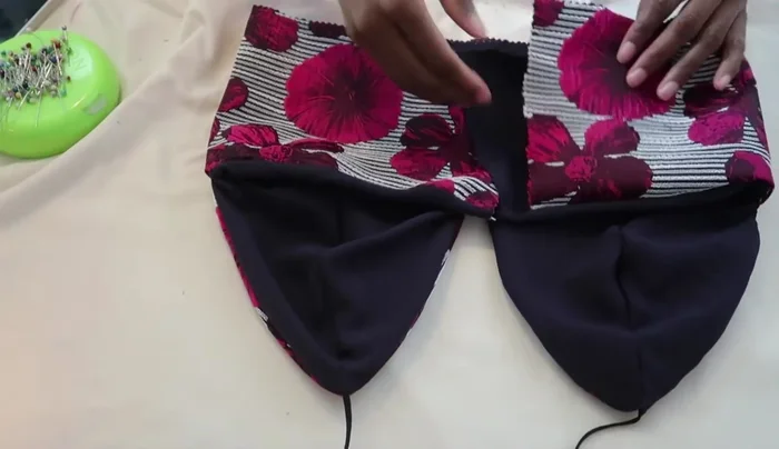 Add straps to back: Create small openings at the back to insert the straps and sew them securely.