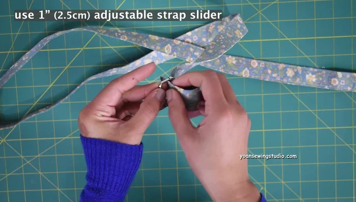 Attach strap to rings.