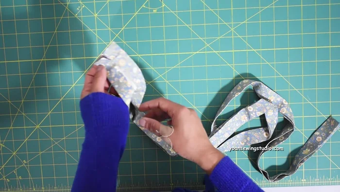 Prepare adjustable strap (55-60 inches long). Join strips if needed (bias join). Apply fusible interfacing (optional). Fold, press, and sew (1/8 inch seam allowance).