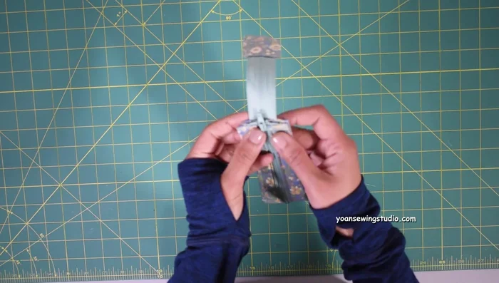 Assemble interior pieces. Sew sides and bottom (1/2 inch seam allowance). Leave opening to turn right side out.