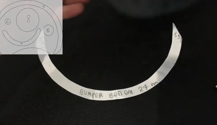 Make the bumper using parts two, four, and five. Sew the long strip (part two) to the front of the bumper (part four), adding embroidery if desired. Attach part four to the base.
