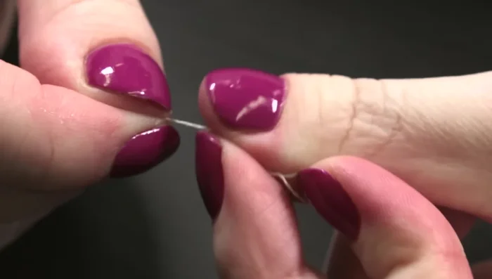 Hand stitch the opening closed using an invisible stitch. Double the thread for strength. The trick is to keep the stitches perpendicular to the folds, creating a ladder-like appearance.