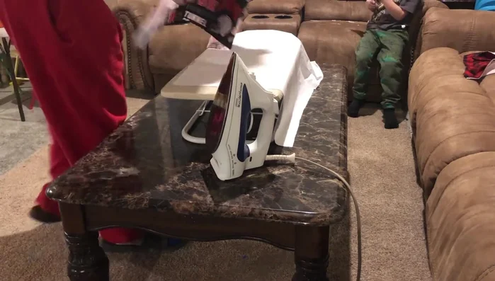 Iron the fabric to ensure it's straight.