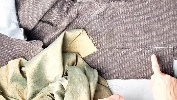 Attach the lining to the bodice, tucking the front center edges from notch to notch. Sew with a 3/8 inch seam allowance, leaving the bottom hem open. 