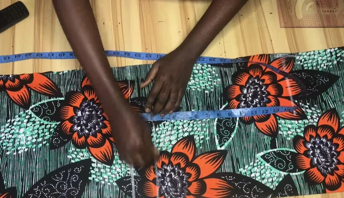 Mark points 2 inches above the knee line and subtract 1.5-2 inches from your hip measurement for the knee and hemline.