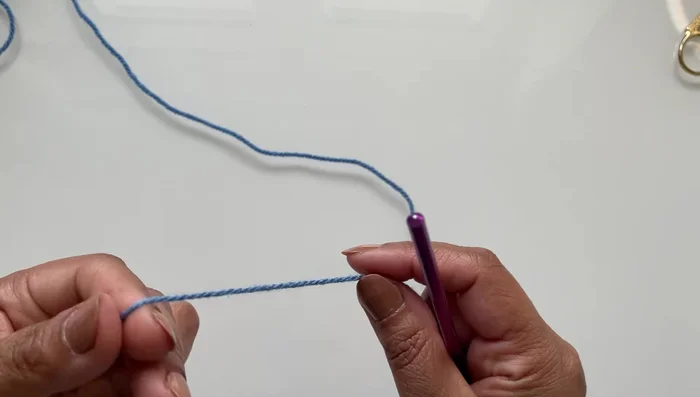 Slip stitch to close the round. Make two of these pieces.