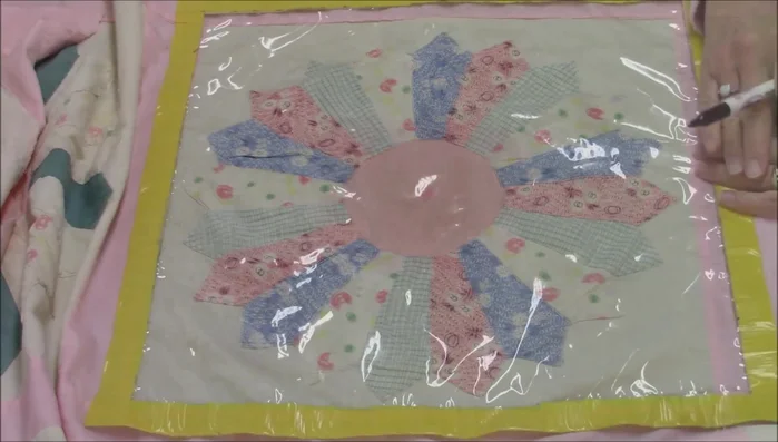 Draw three concentric circles as a guideline on plastic tablecloth.