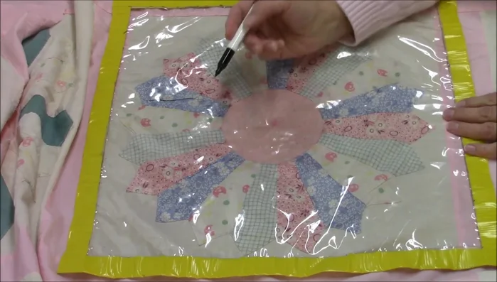Draw simple cross-hatching lines on plastic tablecloth.