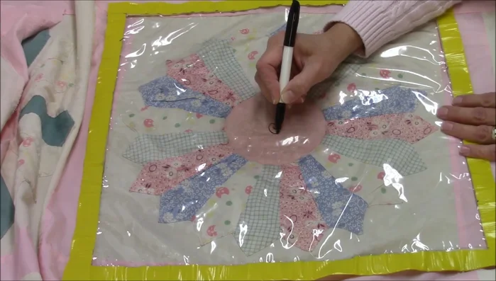 Draw a spiral or a spin feather pattern on plastic tablecloth.