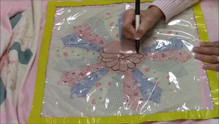 Use the guide to quilt the spiral feather pattern around the Dresden plate center. Adjust circle size as needed.