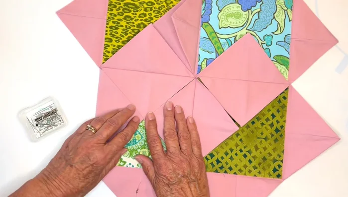 Secure Inner Windows: Pin the flaps down. Secure the middle points with vertical and horizontal stitches for stability.