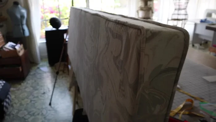 Attach the back fabric piece and staple the entire headboard to the frame.