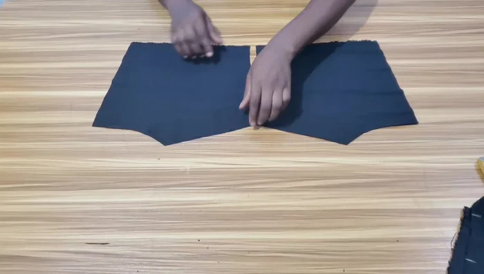 Stitch the facing to the neckline of both bodice pieces.