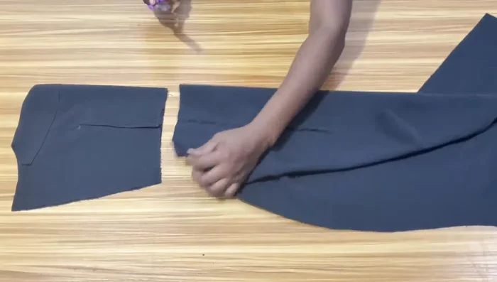 Join the bodice and skirt pieces right sides together. Stitch and finish the seams.