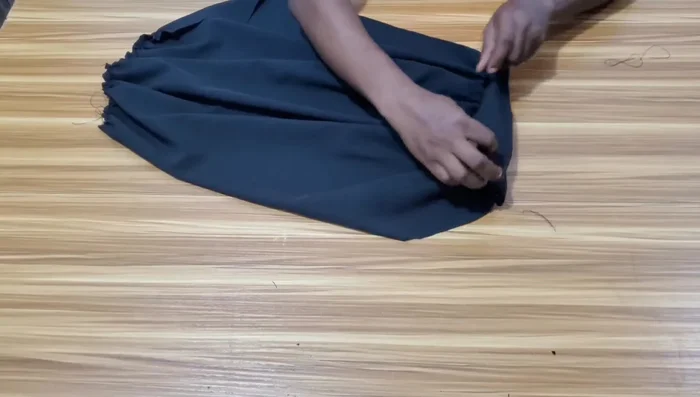 Attach the sleeve bands, and then attach the sleeves into the armholes of the dress.