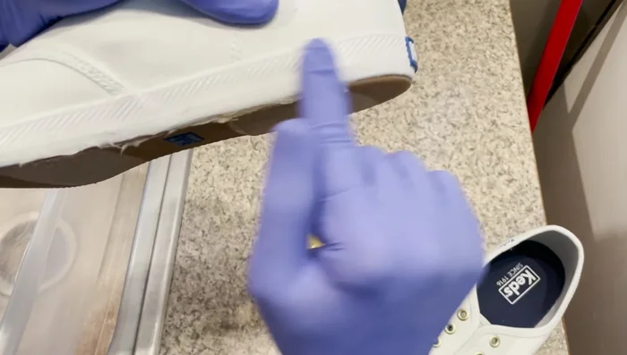 Prepare dye bath: Mix fabric dye according to instructions. The video uses one-half bottle each of two colors for approximately one and a half gallons of water. Add a small amount of dish soap.